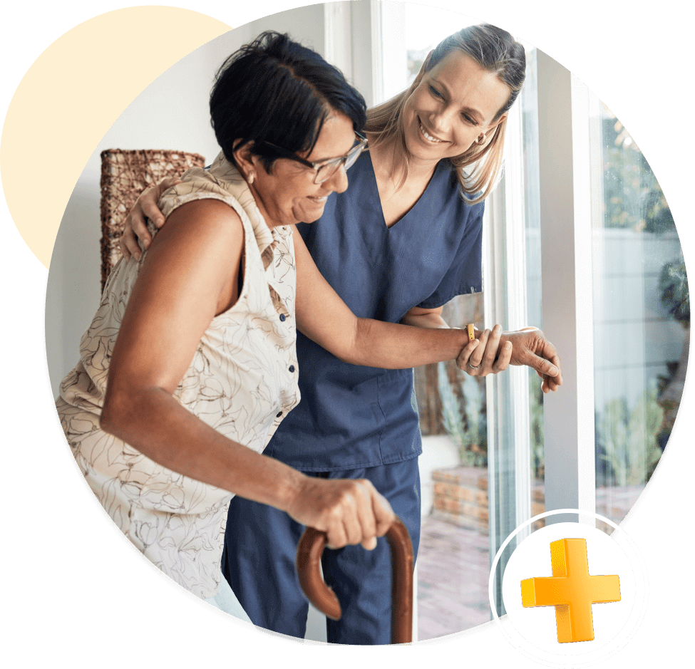 Caregiver assisting elderly woman with cane.