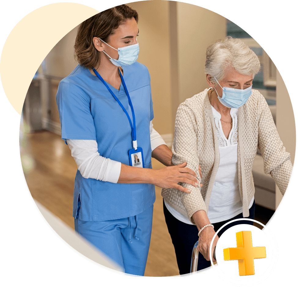 Nurse assisting elderly woman with walker.